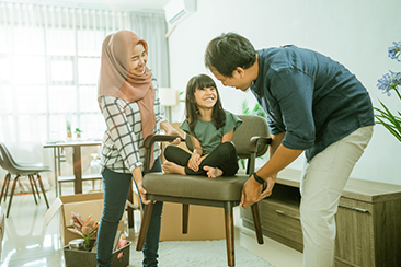 A doctor holding an elderly’s hands who is sitting on a wheelchair