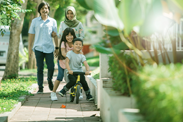 A doctor holding an elderly’s hands who is sitting on a wheelchair