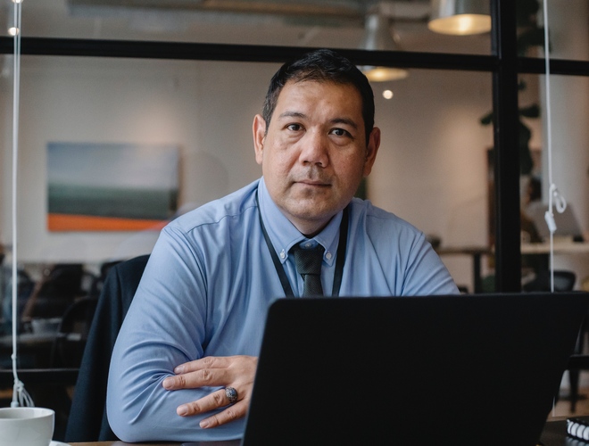a middle age working man with laptop