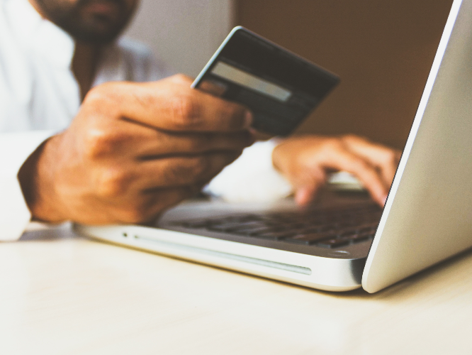 debit card and laptop