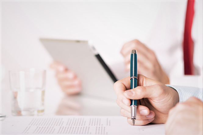 A man signing a document