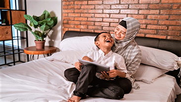 A mother and son on a bed