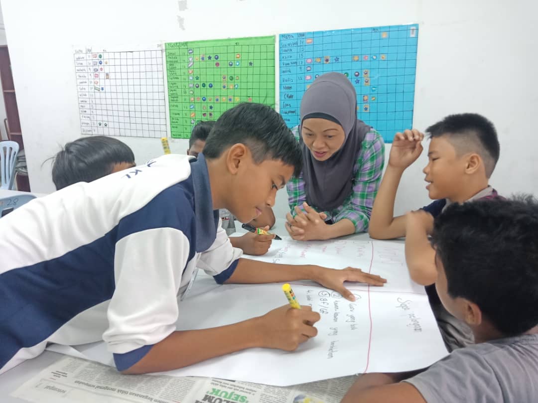 A group of children doing work