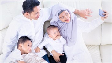 Parents piggybacking children