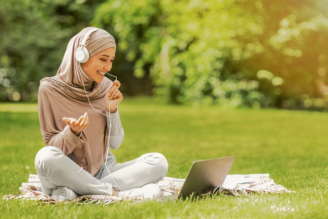 A lady smiling while listening to music